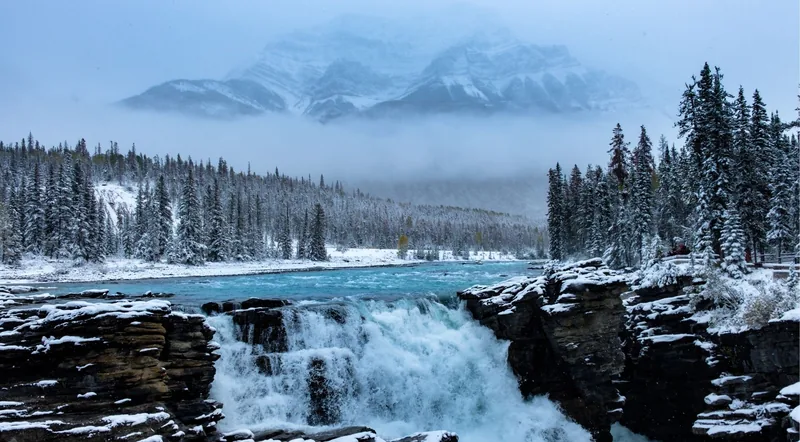 Athabasca Falls in fresh snow, a free roadside stop on the Icefields Parkway near Jasper