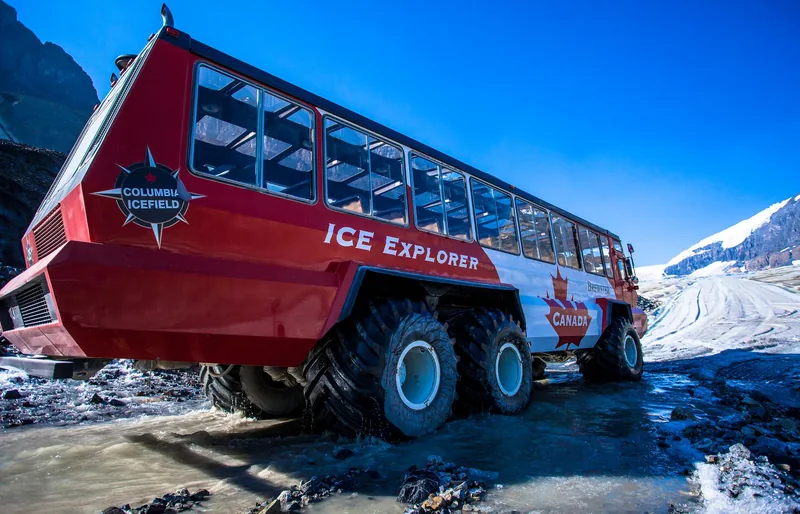 Close view of a six-wheeled Ice Explorer showing its oversized low-pressure tyres